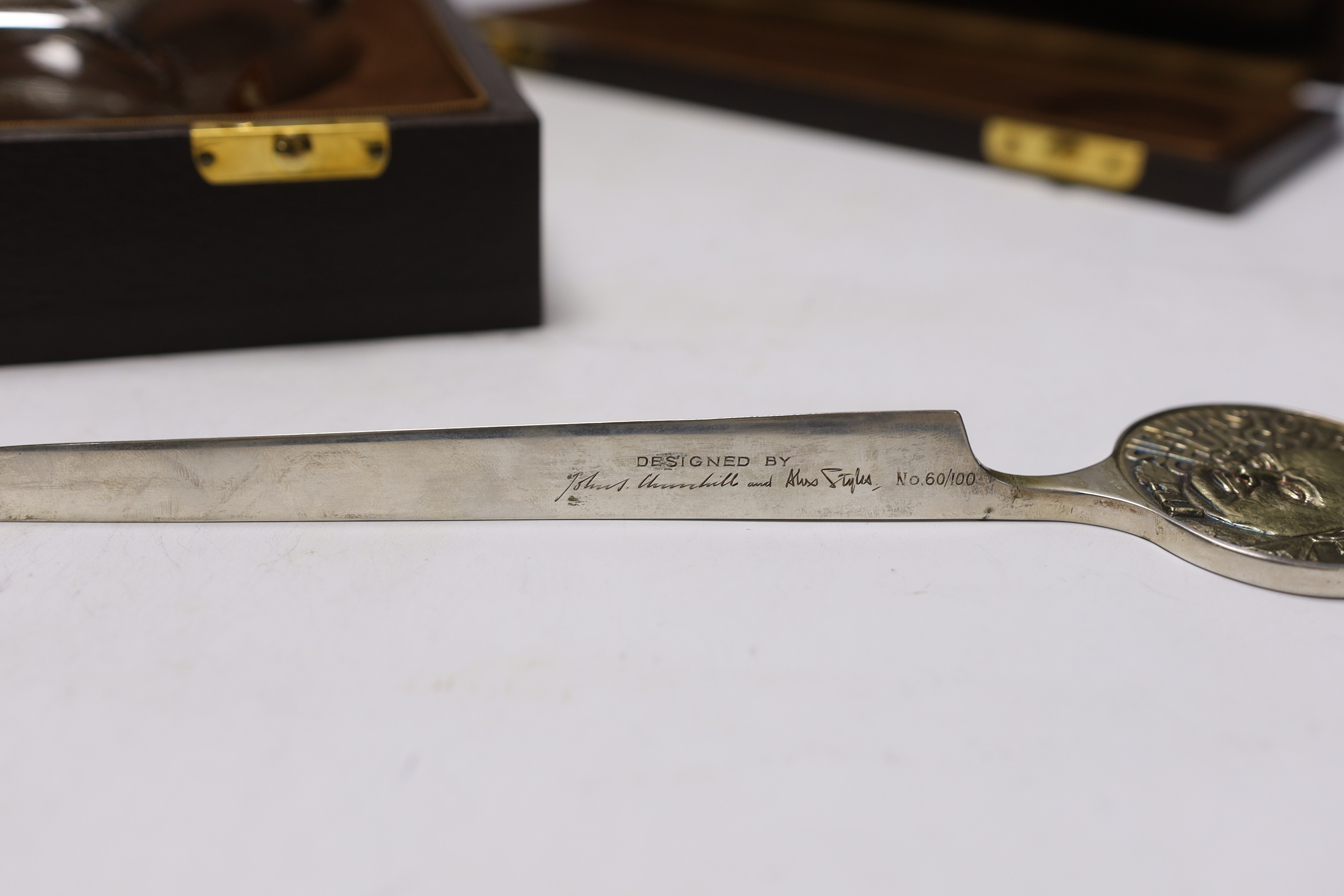 A Churchill commemorative silver letter opener and a commemorative Churchill decanter, Garrard & Co, boxed, letter opener 24.5cm long
